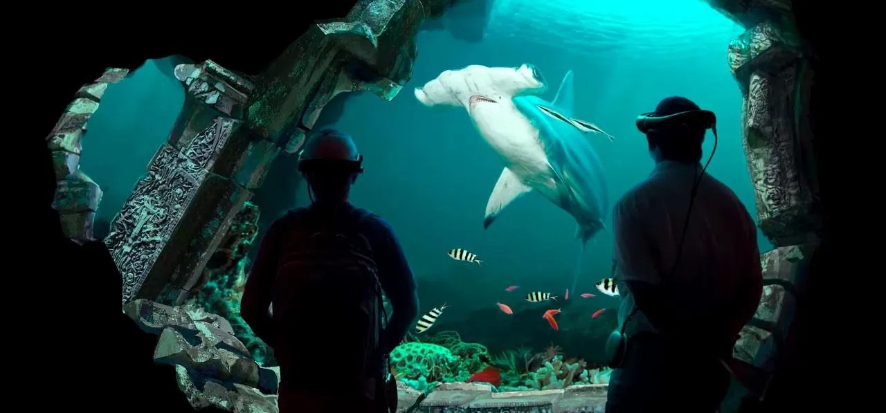 Shark swimming in an underwater exhibit with viewers observing from behind a glass wall.