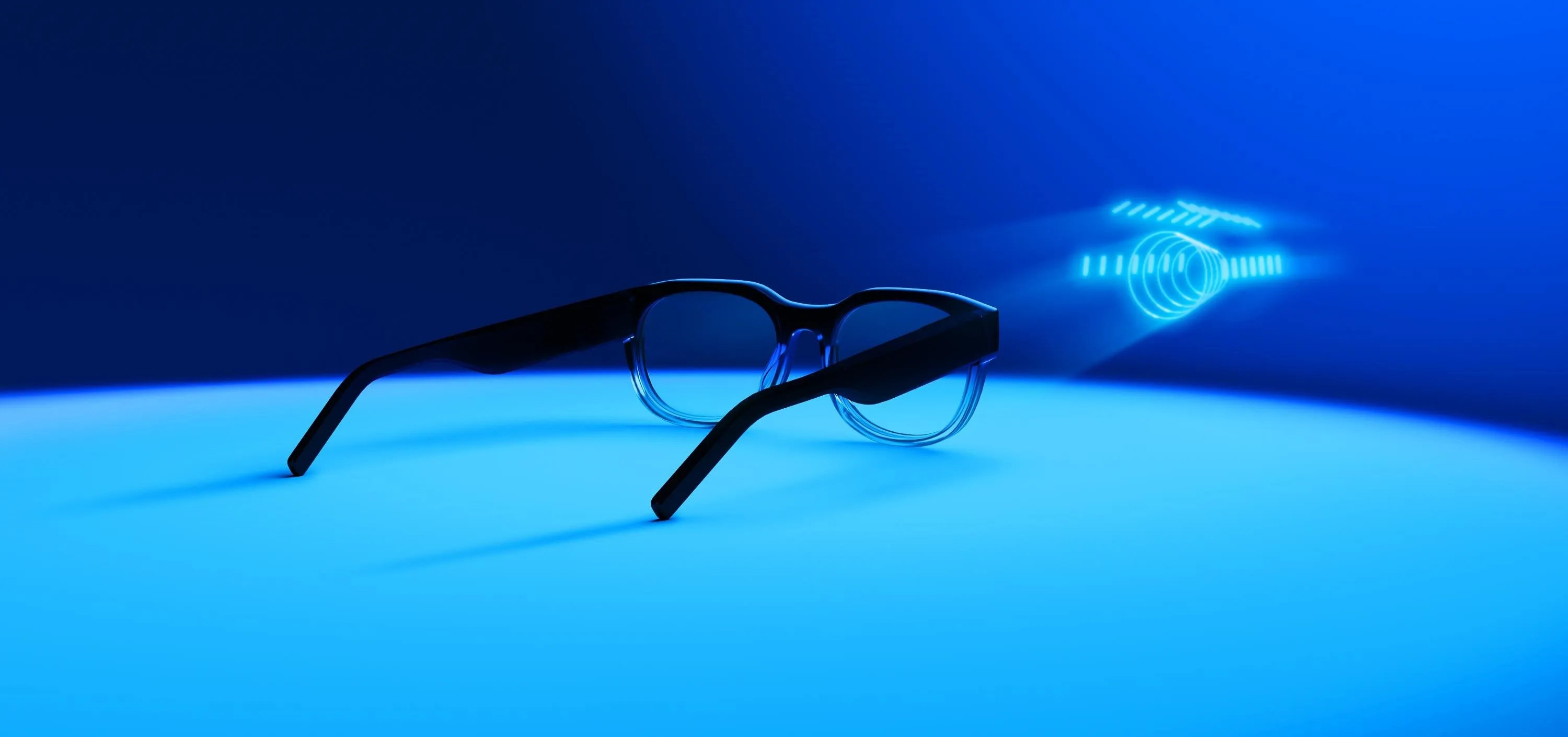 Stylish black eyeglasses on a blue background.